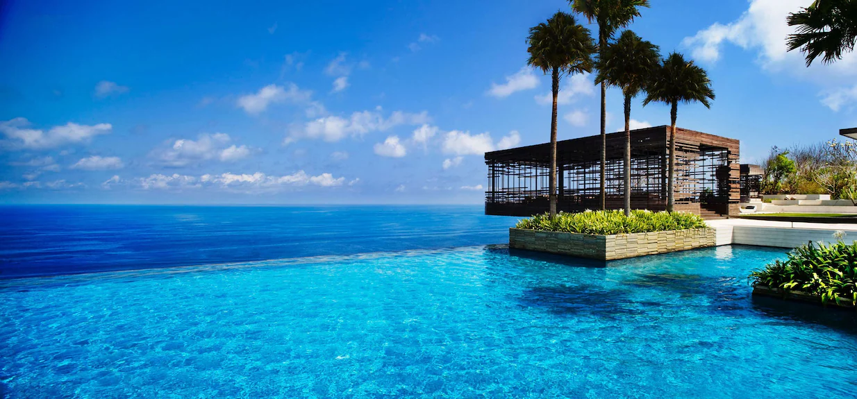 Alila Villas Uluwatu luxury resort in Bali featuring modern minimalist clifftop villas, private infinity pools, panoramic Indian Ocean views, five-star architecture, and exclusive wellness resort experience in Uluwatu. Explore our luxury destination guides to top hotels and resorts worldwide.