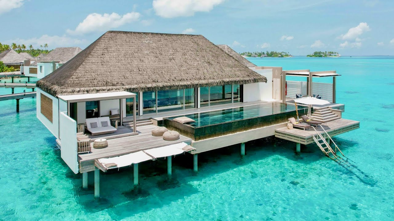 Cheval Blanc Randheli Maldives luxury resort in the Noonu Atoll, showcasing overwater villas with private infinity pools, turquoise lagoon views, world-class service, and ultra-luxury private island accommodations in the Maldives.
