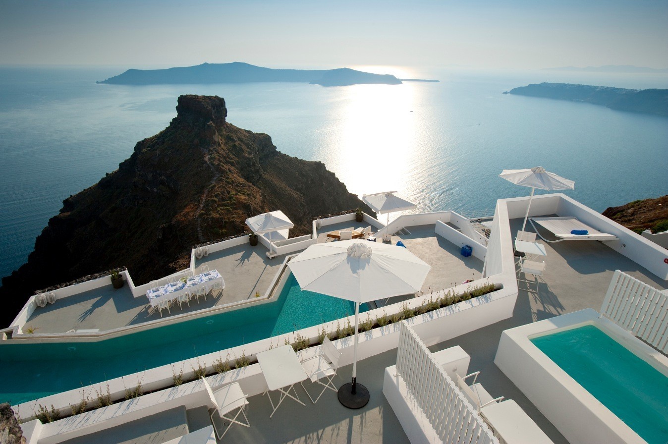 Grace Hotel Santorini is a luxury hotel in Imerovigli overlooking the caldera with private infinity pools, cliffside terraces, and panoramic volcano and Aegean Sea views.