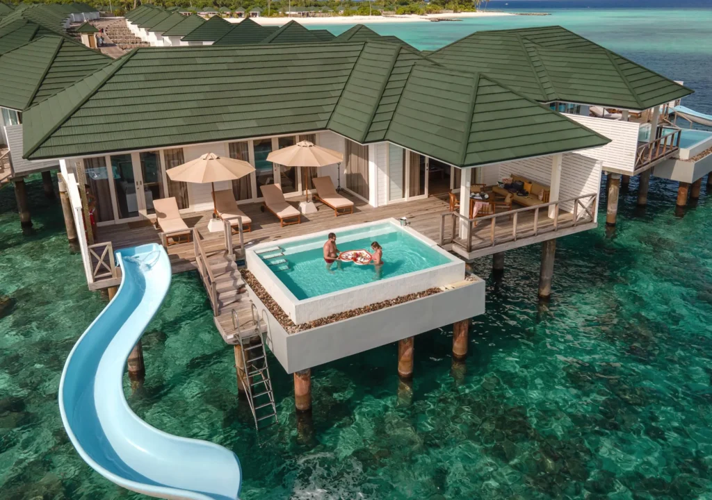 The Top 10 Luxury Maldives Resorts: The Ultimate Guide to the Maldives Best Luxury Hotels, Resorts, and Villas 1 Luxury Maldives overwater villas and Maldives beach resort villas comparison, showcasing overwater villas above turquoise lagoons alongside spacious beach villas with direct sand access at five-star Maldives resorts.