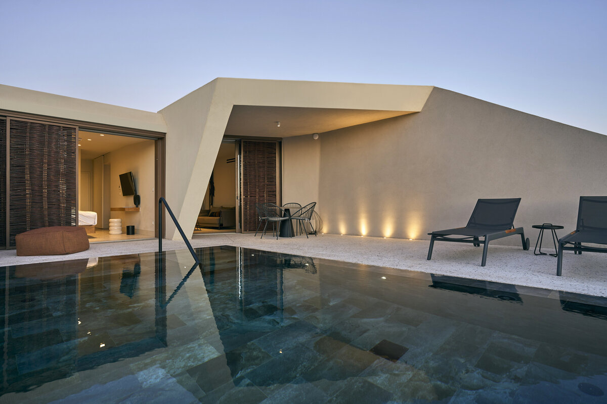 NOŪS Santorini luxury villa with private pool, modern minimalist architecture, expansive terrace, and contemporary design in Mesaria, showcasing a full-scale five-star resort experience.
