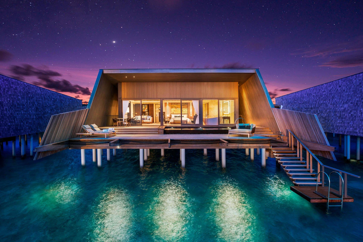 St. Regis Maldives Vommuli luxury resort featuring architecturally distinctive overwater villas, the iconic Whale Bar, private plunge pools, and ultra-luxury island living in the Maldives.