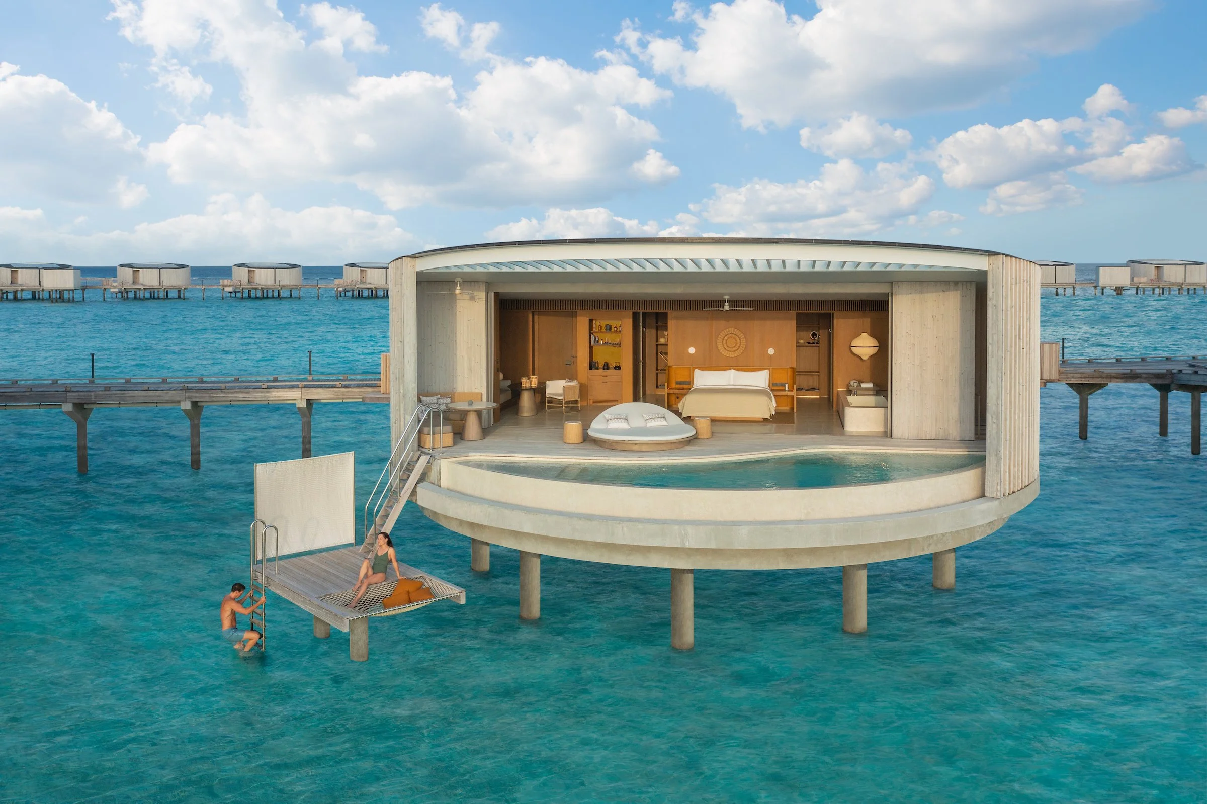The Ritz-Carlton Maldives Fari Islands luxury resort featuring circular overwater villas designed by Kerry Hill Architects, private infinity pools, minimalist island design, and refined five-star living in the Maldives.