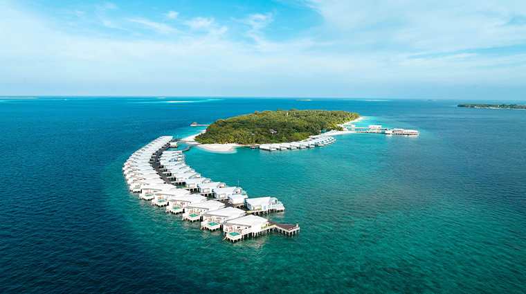Luxury overwater villas in Maldives at sunset at one of the best Maldives resorts, featuring private Maldives water bungalows above a turquoise lagoon, perfect for a Maldives luxury vacation and exclusive island escape.​