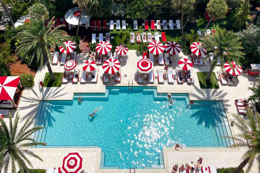 Faena Hotel Miami Beach oceanfront luxury hotel with Carrara marble suites, private butler service, modern art including Damien Hirst sculpture, and Miami beachfront pool.