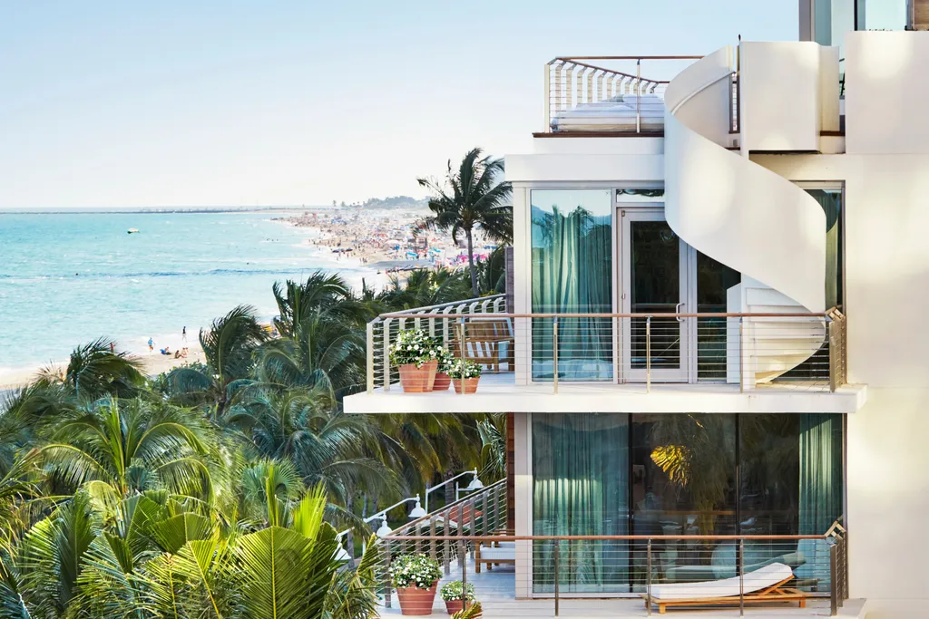 Luxury Mid-Beach Miami hotel with oceanfront suites, private balconies, spa, cabana-lined pools, and Matador Room by Jean-Georges.