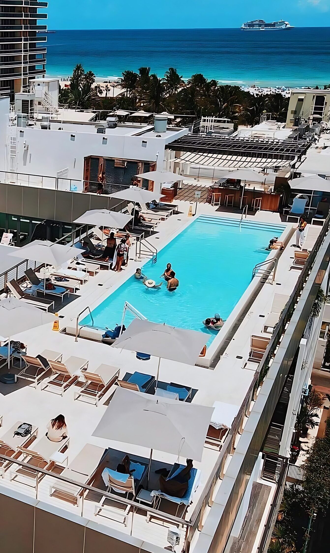 Alt: The Betsy Hotel South Beach with oceanfront rooftop pool, wellness terrace, Art Deco design, private beach service, and luxury boutique hotel amenities overlooking the Atlantic Ocean.