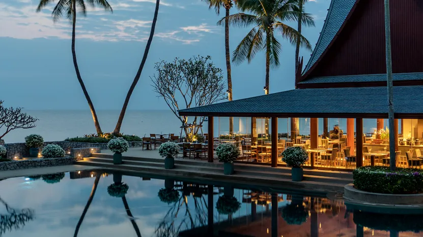 Beachfront view of Chiva-Som in Hua Hin, Thailand, a serene luxury wellness retreat with tropical gardens, open-air pavilions, and a renowned luxury spa offering personalized programs at one of Thailand’s best luxury wellness hotels.