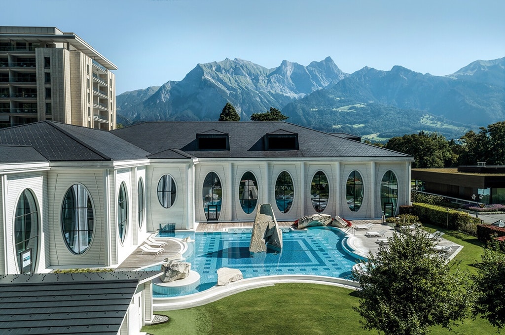 Grand Resort Bad Ragaz in Switzerland, a luxury wellness and longevity retreat with sleek medical spa facilities and mountain views, offering advanced anti-aging treatments, regenerative medicine, and personalized health optimization programs.