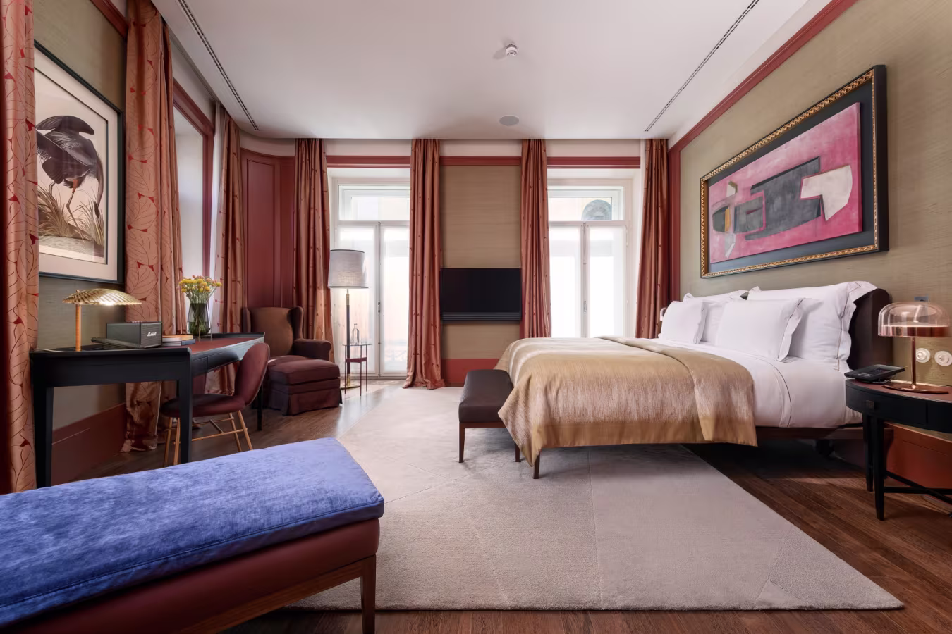 Luxury suite at Bairro Alto Hotel Lisbon featuring modern Portuguese design, premium bedding, wood flooring, curated artwork, and large windows overlooking the Chiado and Bairro Alto district. Bairro Alto Hotel | Bairro Alto | Hotel do Bairro Alto | Bairro Alto Lisbon | Bairro Alto Hotels | Bairro Alto Suites | Luxury hotels in Lisbon | Best 5 Star Hotels in Lisbon | Best Hotels Lisbon