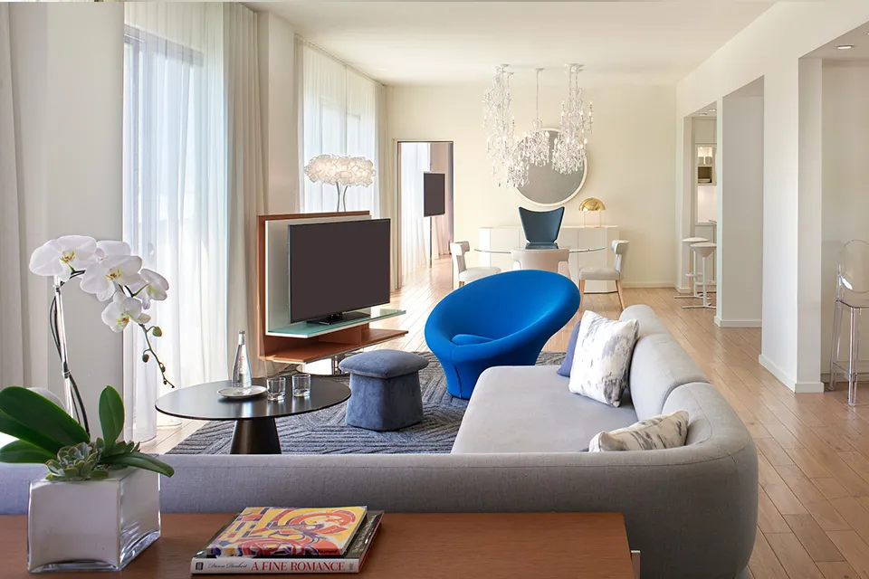 The Mondrian Los Angeles features bright modern hotel room with floor-to-ceiling windows, modern white-on-white interiors, Hollywood Hills views, and luxury boutique design on the Sunset Strip.