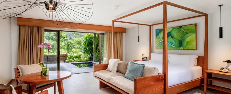 Tabacon Thermal Resort & Spa in La Fortuna, Costa Rica, featuring natural hot springs, five-star luxury accommodations, rainforest surroundings, and Arenal Volcano views.